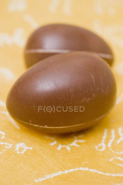 Eggs on yellow surface — Stock Photo