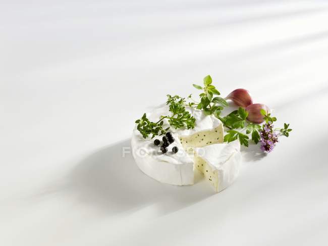 Camembert with herbs and garlic — Stock Photo