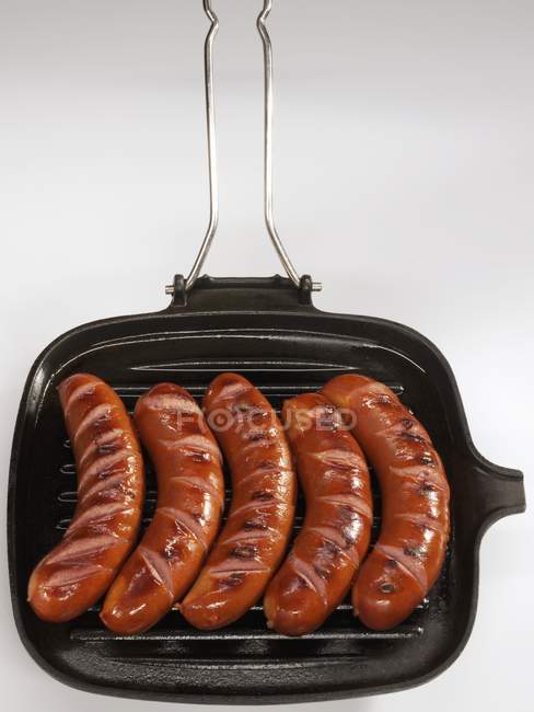 Bockwurst sausages in grill pan — Stock Photo
