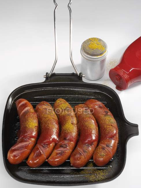 Currywurst sausages with ketchup — Stock Photo