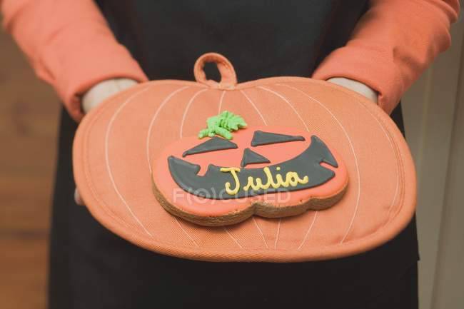 Halloween biscuit with name on pot holder — Stock Photo