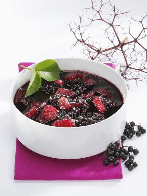 Closeup view of pear and elderberry soup in bowl — Stock Photo