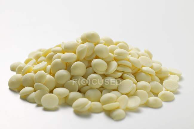 Heap of white chocolate chips — Stock Photo