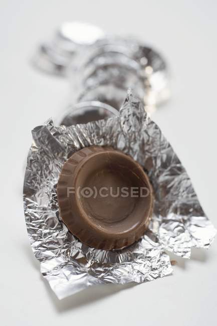 Chocolate thins in silver paper — Stock Photo