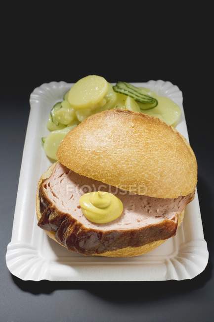 Leberkase in bread with mustard — Stock Photo
