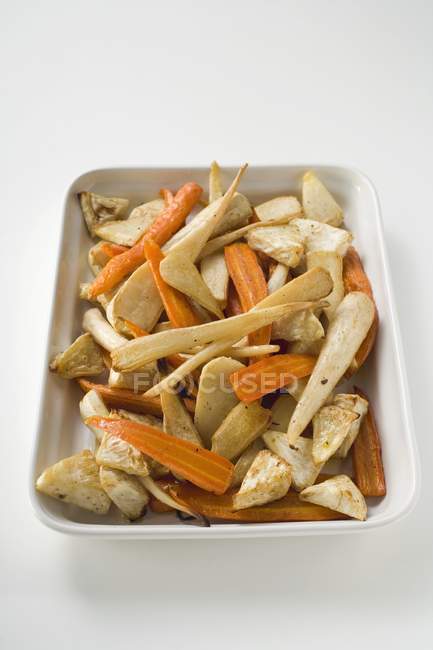 Roasted carrots with parsnips and celeriac — Stock Photo