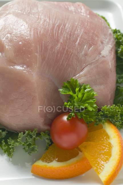 Fresh pork with vegetable garnish — Stock Photo