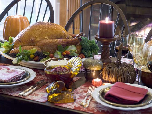 Stuffed turkey on set Thanksgiving table — Stock Photo