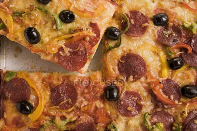 Salami pizza with peppers — Stock Photo
