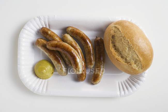 Salsicce con senape e panino — Foto stock