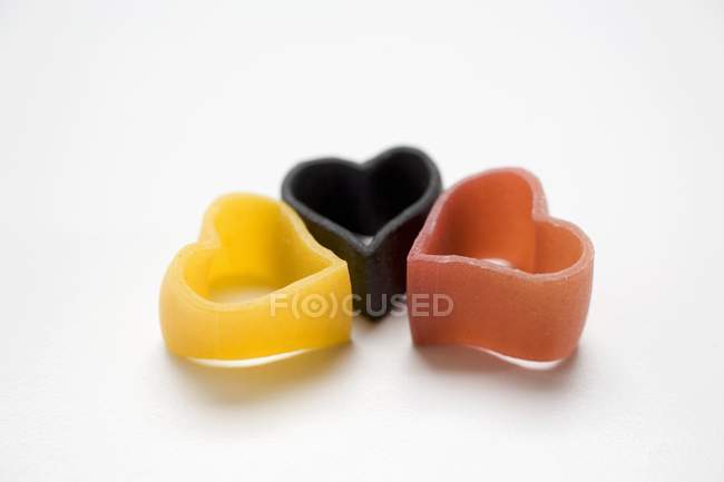 Dry uncooked heart-shaped pasta — Stock Photo