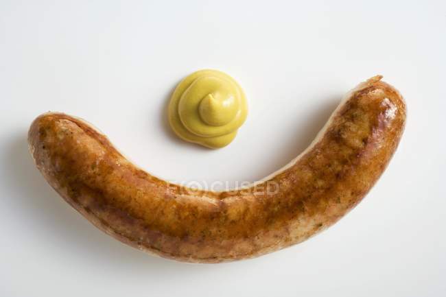 Salsicha assada com mostarda — Fotografia de Stock
