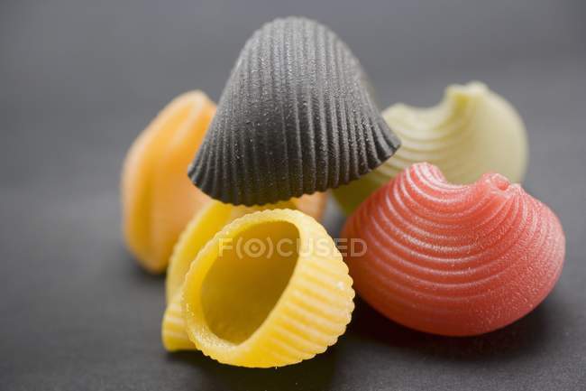 Coloured lumaconi pasta shells — Stock Photo