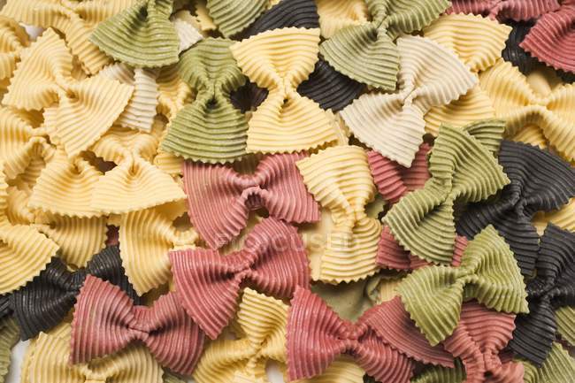 Coloured farfalle pasta — стокове фото