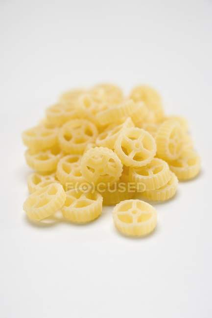 Heap of wagon wheel pasta — Stock Photo