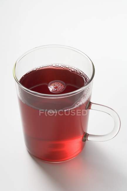 Fruit tea in glass cup — Stock Photo