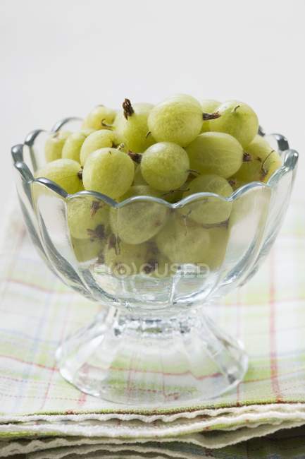 Gooseberries in glass bowl — Stock Photo