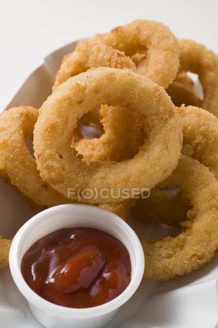 Squid rings in paper dish — Stock Photo