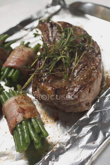 Beef steak with bacon — Stock Photo