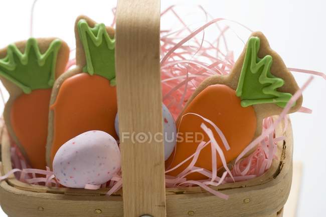 Sugar eggs in basket — Stock Photo