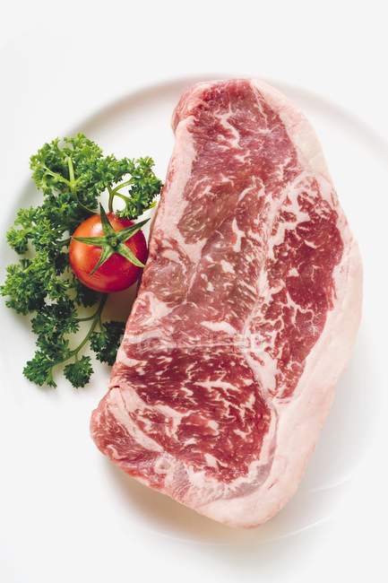 Beef steak with parsley — Stock Photo