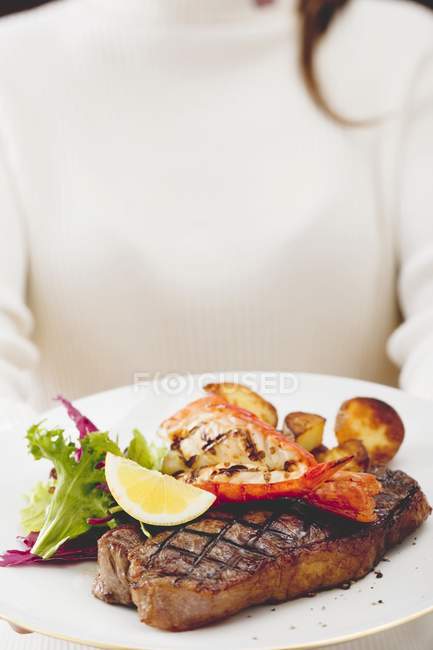 Steak with lobster and roasted potatoes — Stock Photo