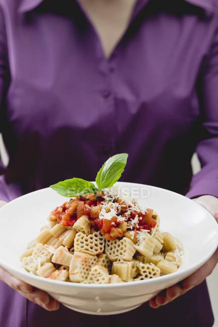 Woman holding bowl of Pasta — Stock Photo