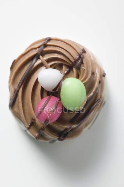 Sugar eggs on cream — Stock Photo