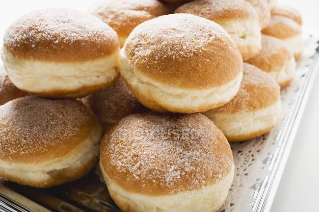 Fresh doughnuts on platter — Stock Photo