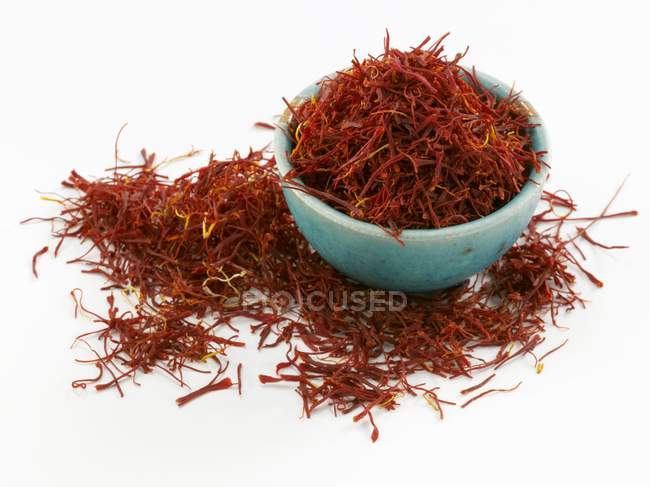 Saffron threads in blue bowl — Stock Photo