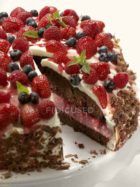 Chocolate cake with quark filling and berries — Stock Photo
