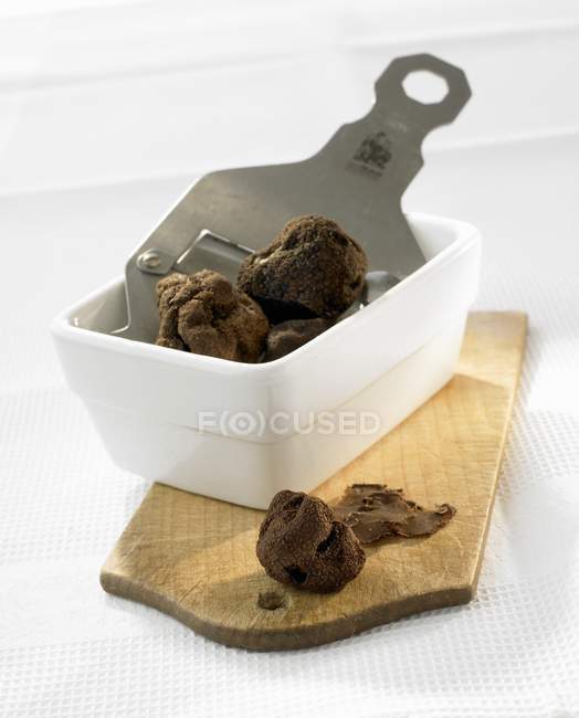 Truffles and truffle slicer — Stock Photo