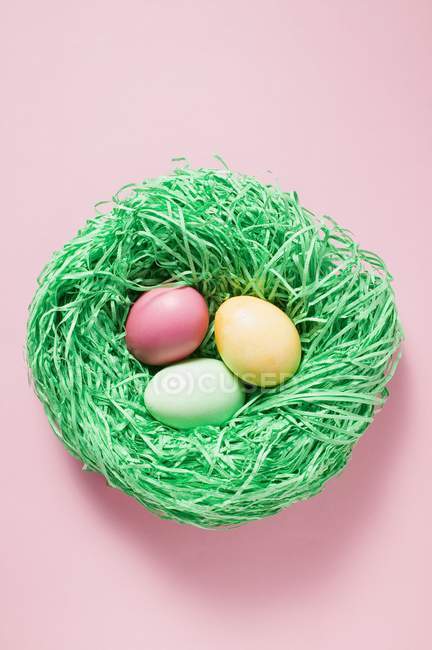 Sugar eggs in nest — Stock Photo