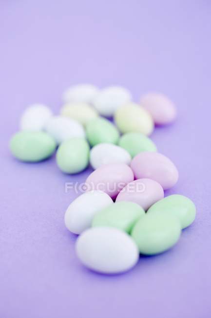 Sugar eggs on purple — Stock Photo