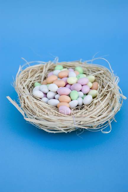 Sugar eggs over blue background — Stock Photo