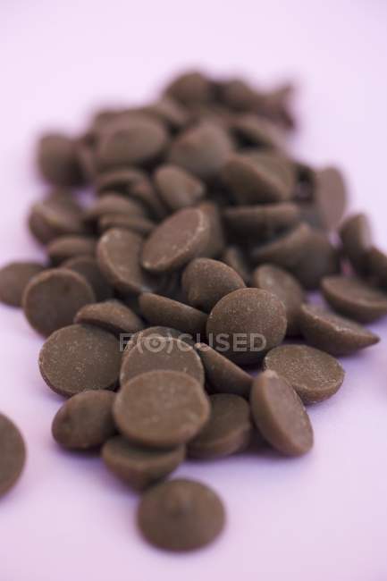 Heap of chocolate buttons — Stock Photo