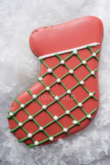 Christmas biscuit in shape of red boot — Stock Photo