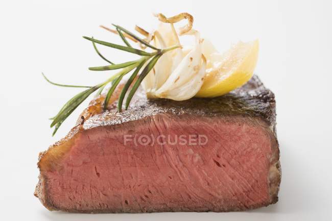 Beef steak with rosemary — Stock Photo