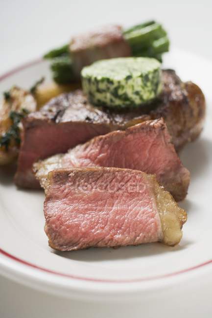 Beef steak with butter — Stock Photo