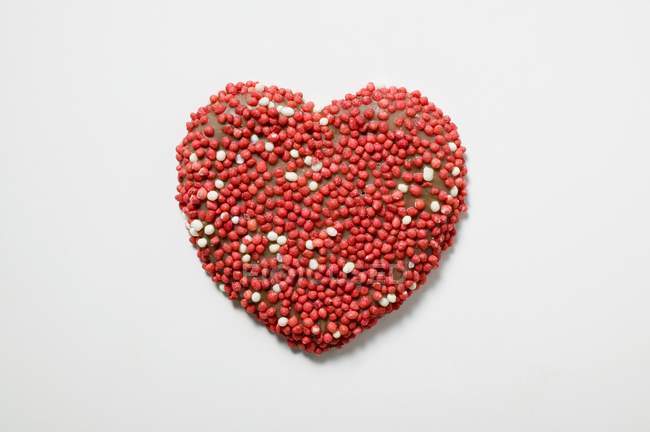 Chocolate heart with sprinkles — Stock Photo