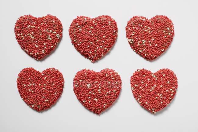 Chocolate hearts with sprinkles — Stock Photo