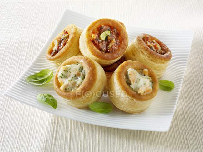 Closeup view of puff pastry cases with various fillings — Stock Photo