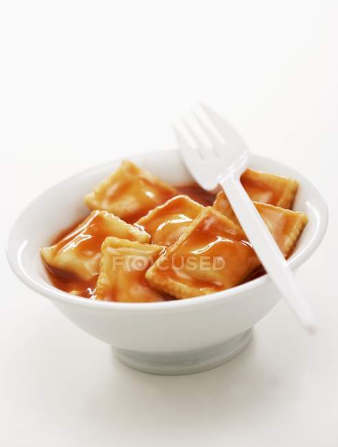 Ravioli pasta in tomato sauce — Stock Photo