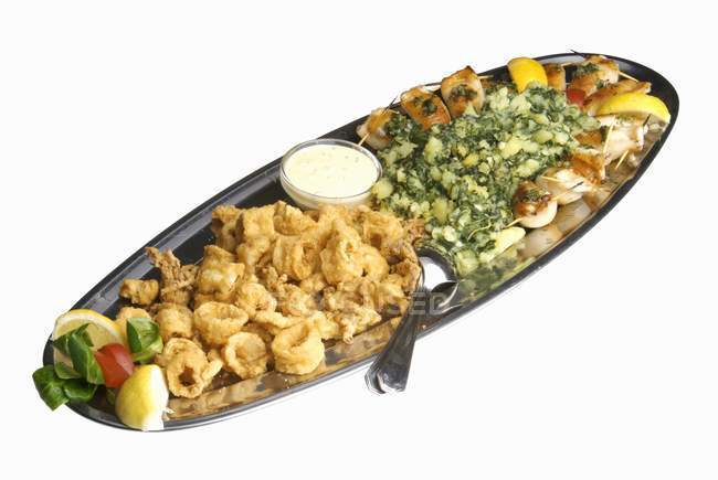 Seafood platter with potatoes — Stock Photo