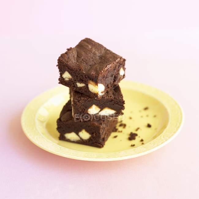 Pile of brownies stacked on plate — Stock Photo