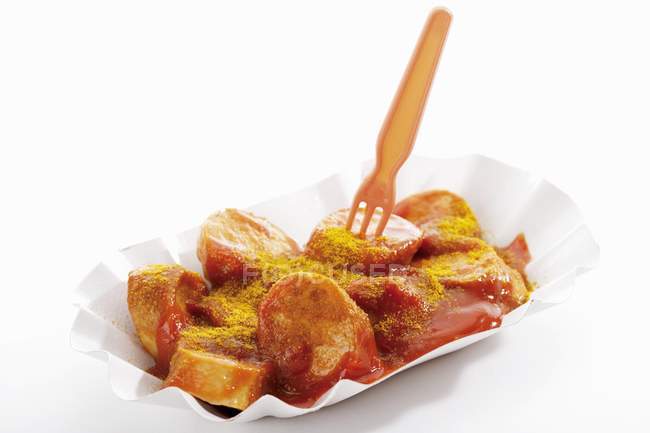 Salsiccia con ketchup e curry in polvere — Foto stock