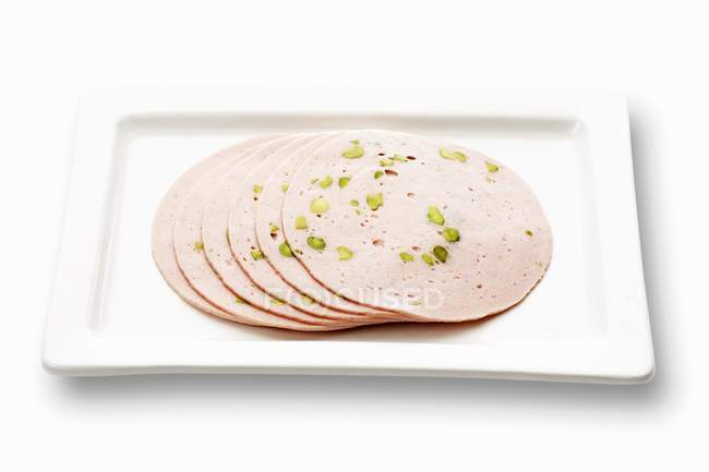 Sliced Veal sausage with pistachios — Stock Photo