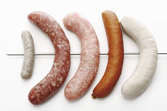 Different types of sausages on skewer — Stock Photo