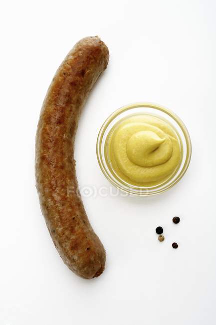 Roasted sausage with mustard — Stock Photo