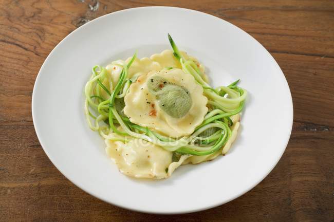 Ravioli pasta with courgette laces — Stock Photo